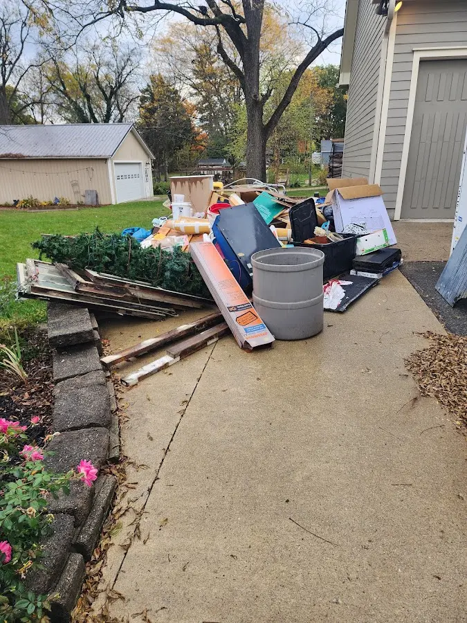 Dumpster being loaded with debris for Residential Dumpster Rental in East Cocalico